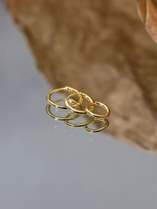 Emilie – Pendientes de oro fino con un suave brillo.