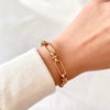 Marisa – Pulsera dorada con una delicada estructura doble.