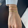 Carina – Pulsera de oro con estructura de platino brillante.
