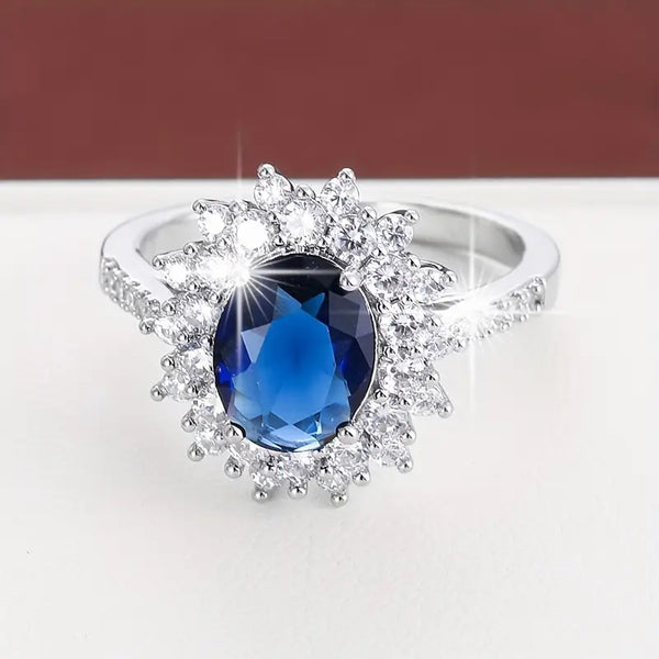 Karolína – Anillo dorado con zafiro floral.