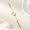 Aurelia – Reloj de dama dorado con esfera en forma de gota.