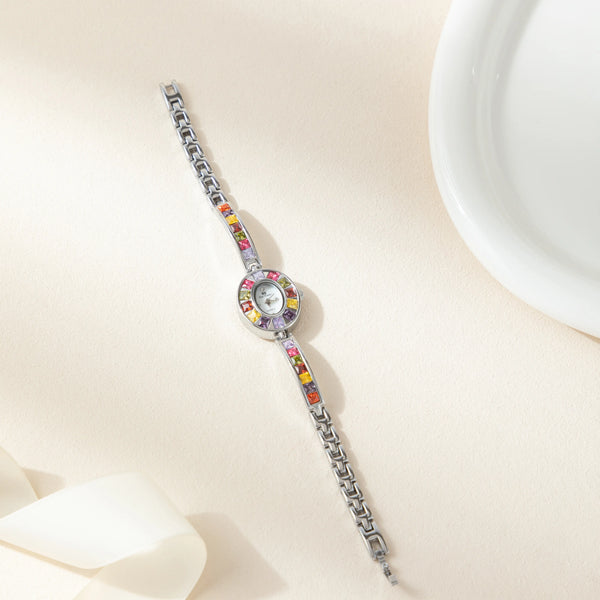Amelie – Reloj dorado con marco de cristal.
