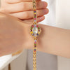 Amelie – Reloj dorado con marco de cristal.
