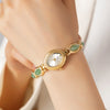 Clara – Reloj dorado con esfera alargada.