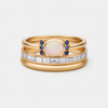 Theresa – Un fino anillo de oro con un opal brillante y contornos claros.