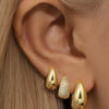 Rosalie – Pendientes dorados suaves con estructura curva.