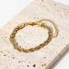 Lena – Pulsera dorada con delicada estructura de cordón
