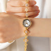 Elina – Reloj dorado con pulsera de inspiración floral.