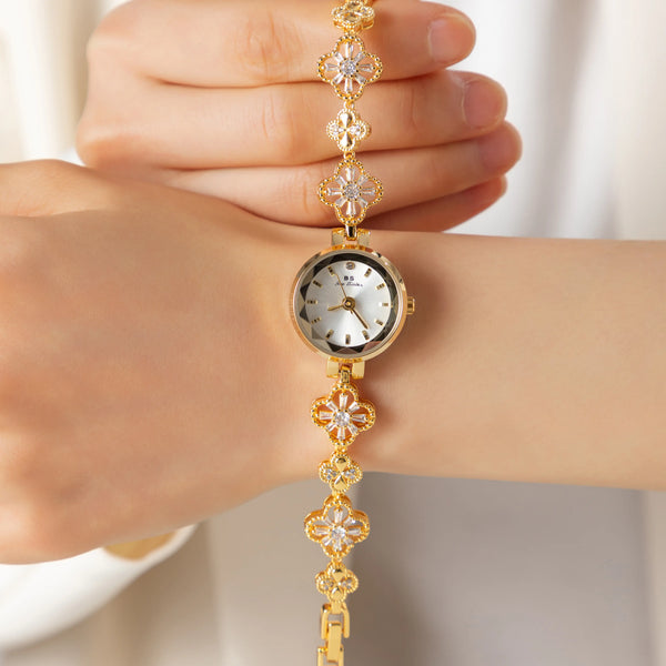Elina – Reloj dorado con pulsera de inspiración floral.