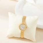 Magdalena – Gold watch with a narrow strap.