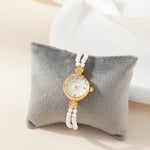 Johanna – Reloj dorado con borde de cristal.