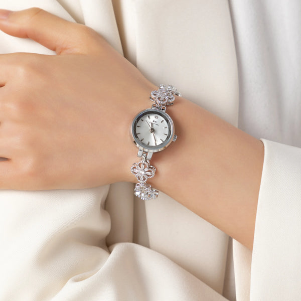 Elina – Reloj dorado con pulsera de inspiración floral.