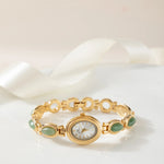 Clara – Reloj dorado con esfera alargada.