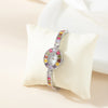Amelie – Reloj dorado con marco de cristal.