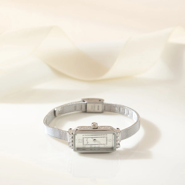 Theresa – Reloj dorado con esfera rectangular.