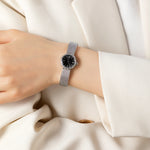 Magdalena – Gold watch with a narrow strap.