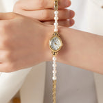 Aurelia – Reloj de dama dorado con esfera en forma de gota.