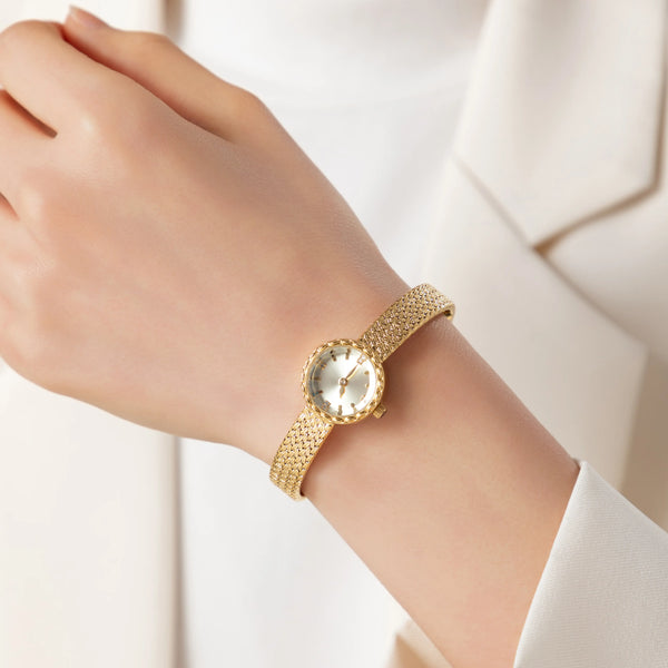 Magdalena – Gold watch with a narrow strap.