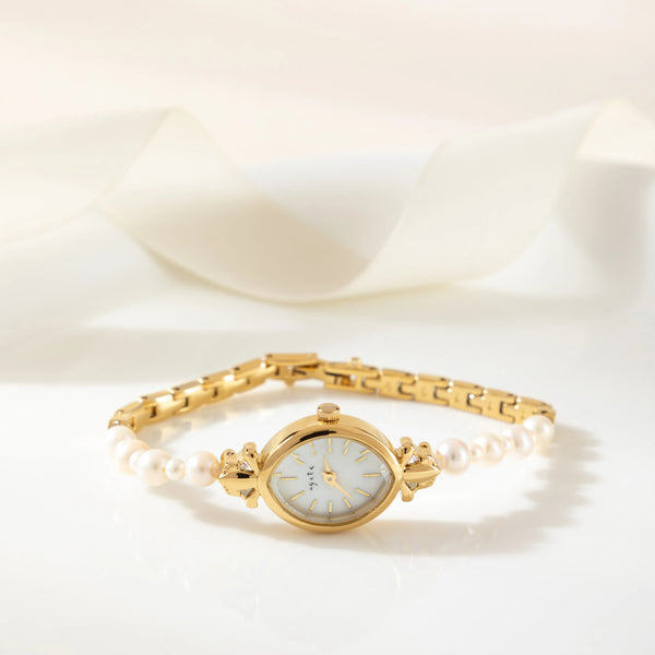 Aurelia – Reloj de dama dorado con esfera en forma de gota.