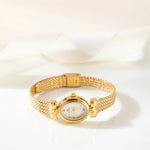 Selina – Reloj dorado con diseño ovalado.