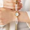 Johanna – Reloj dorado con borde de cristal.