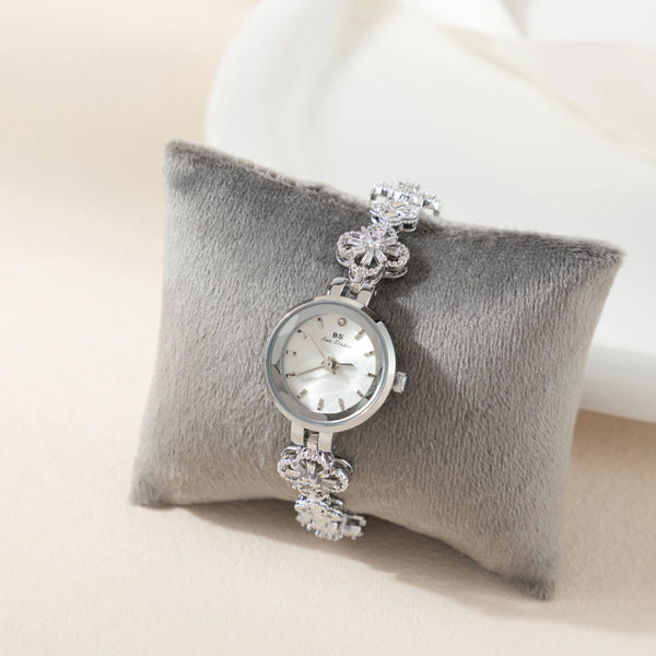 Elina – Reloj dorado con pulsera de inspiración floral.