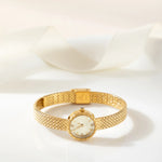 Magdalena – Gold watch with a narrow strap.
