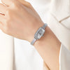 Theresa – Reloj dorado con esfera rectangular.