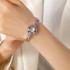 Amelie – Reloj dorado con marco de cristal.