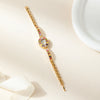 Amelie – Reloj dorado con marco de cristal.