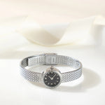 Magdalena – Gold watch with a narrow strap.