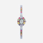 Amelie – Reloj dorado con marco de cristal.