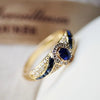 Beatrix – Anillo dorado con doble piedra.