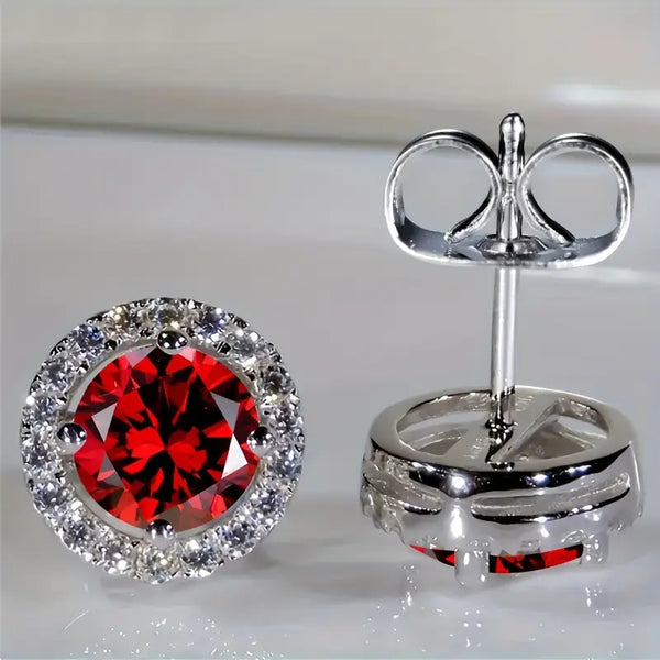 Luisa – Pendientes de rubí con diseño solar.
