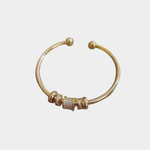 Nina - Pulsera ajustable con charms de oro