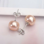 Frieda – Pendientes de oro con perlas y forma clara.
