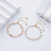 Carina – Pendientes de oro con perlas móviles.