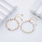 Carina – Pendientes de oro con perlas móviles.
