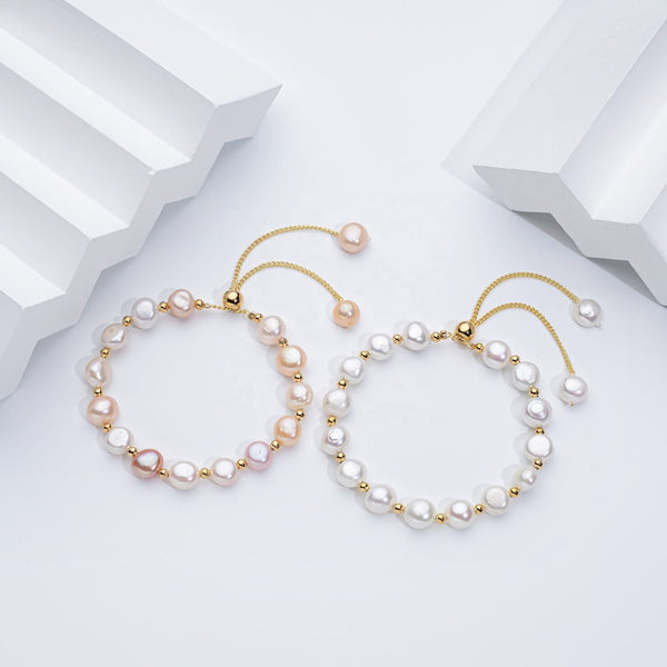 Carina – Pendientes de oro con perlas móviles.