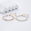Carina – Pendientes de oro con perlas móviles.
