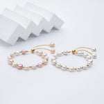 Carina – Pendientes de oro con perlas móviles.