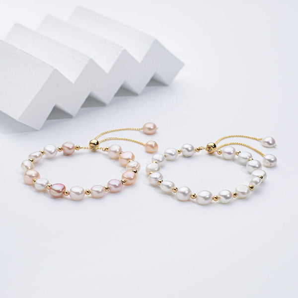 Carina – Pendientes de oro con perlas móviles.