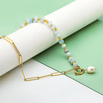 Zoé – Pendientes largos dorados con colgante de perla.