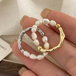 Elisa – Anillo de perlas juguetón con corazón dorado.
