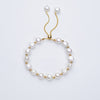 Carina – Pendientes de oro con perlas móviles.