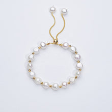 Carina – Pendientes de oro con perlas móviles.