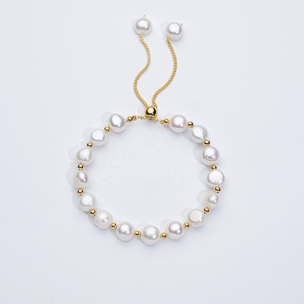 Carina – Pendientes de oro con perlas móviles.
