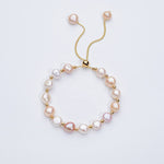 Carina – Pendientes de oro con perlas móviles.