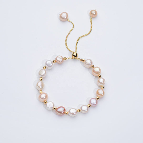 Carina – Pendientes de oro con perlas móviles.