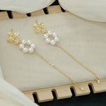 Viktorie – Collar de perlas con brillo dorado.